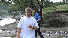 Tao and Gavin try to run away from the midges on the shores of Revsvatnet near the youth hostel